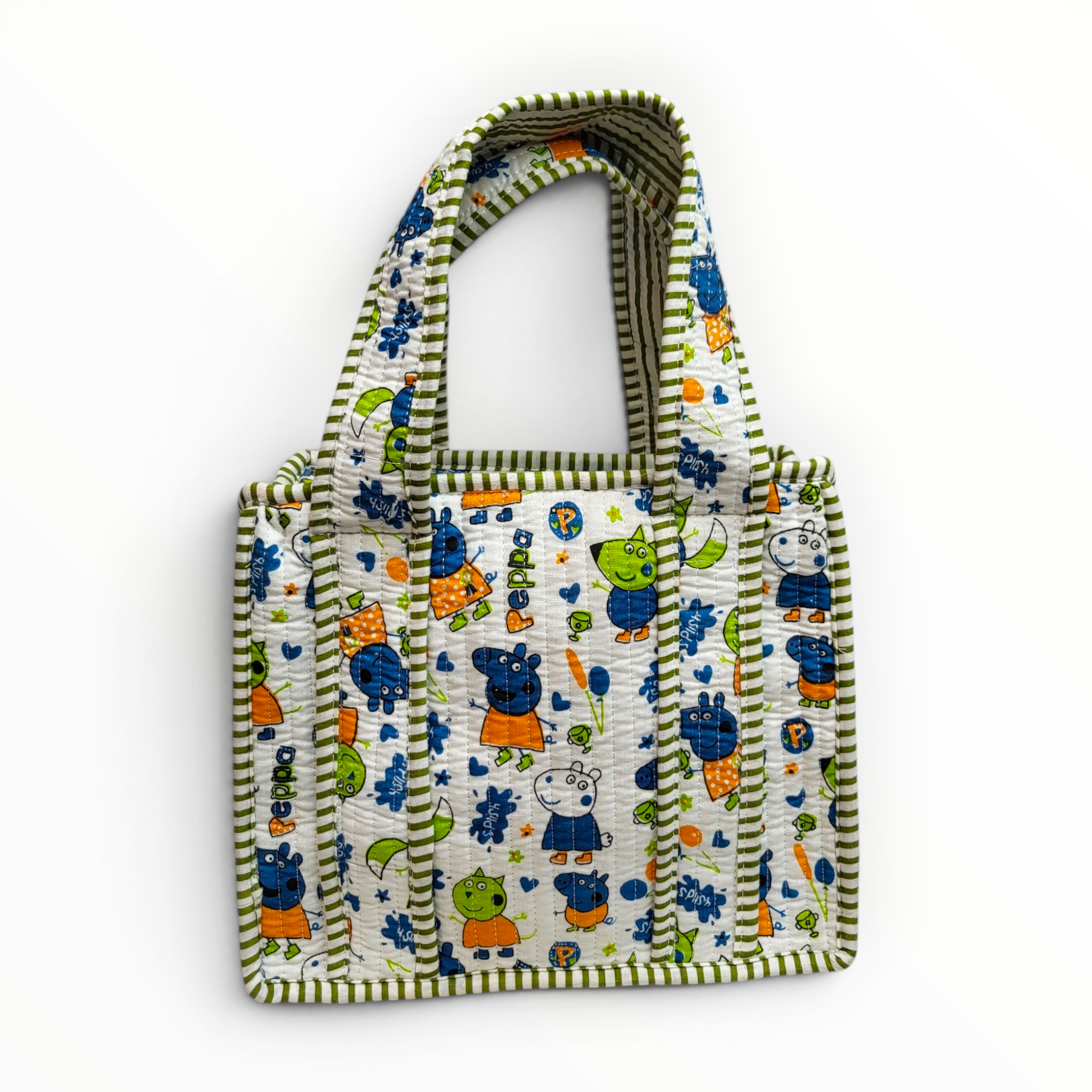 Front view of a white quilted cotton kids lunch bag featuring colorful cartoon pig character prints and olive green and white striped handles.