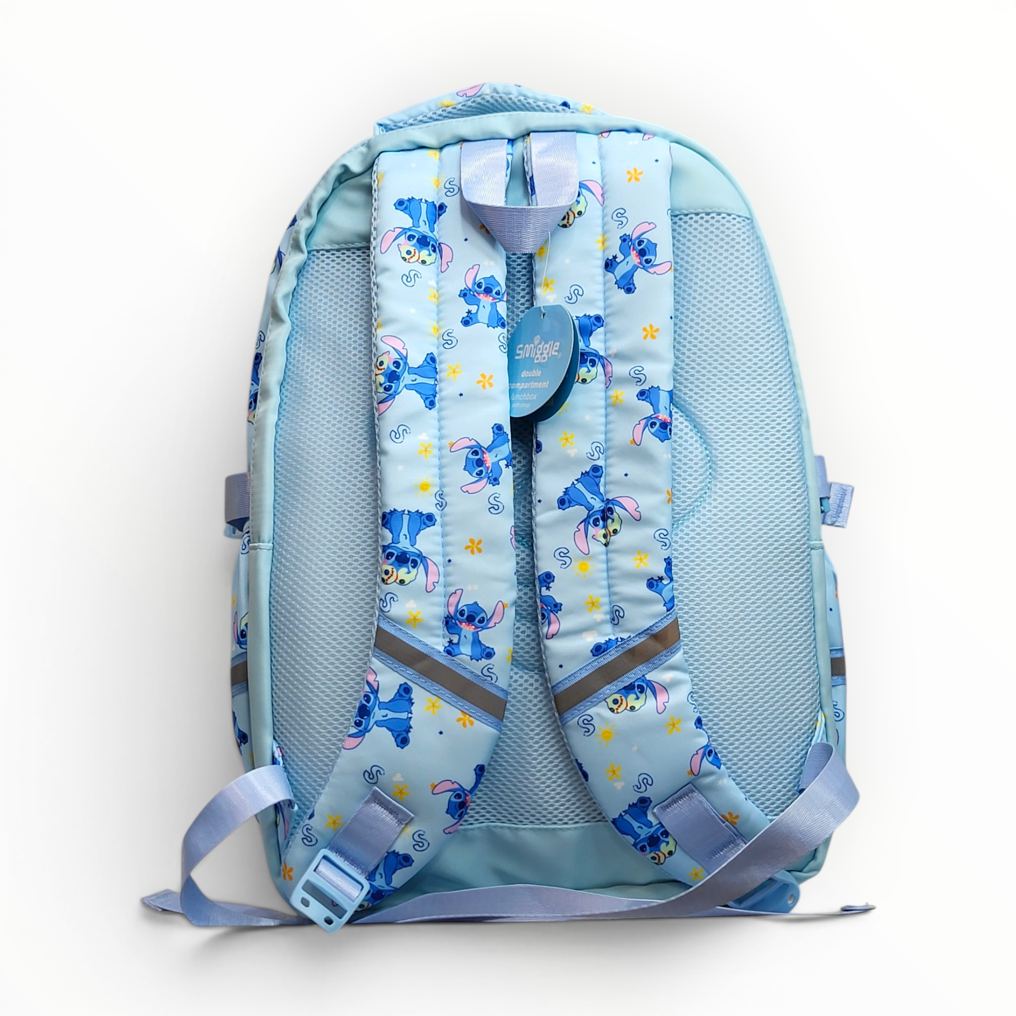 Rear view showcasing the padded light blue mesh backing, printed shoulder straps with safety reflectors, and the authentic Smiggle tag.