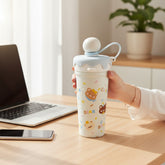Tiny Tokens light blue and white steel sipper bottle with ice cream cone lid, straw, and cute bear print. Features leak-proof design.