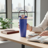 Tiny Tokens blue steel tumbler with foldable handle and flip spout lid for kids.
