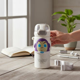 Tiny Tokens Buzz Lightyear kids water bottle with 3D badge, flip straw lid, and adjustable strap. White BPA-free plastic.