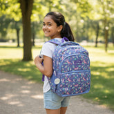 Tiny Tokens Bubbles girls backpack with cute otter and floral print in pastel blue, pink, and green. Features padded straps and multiple compartments.