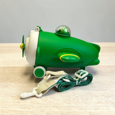Tiny Tokens green and cream rocket spaceship water bottle with straw lid and shoulder strap for kids.