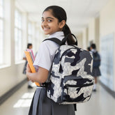 Tiny Tokens grey and white NY print camouflage mini backpack with padded straps and front zip pocket.