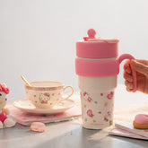 Tiny Tokens pink Hello Kitty insulated steel sipper bottle with flip straw and handle for kids.