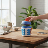 Tiny Tokens insulated soup and shake cup with built-in whisk, blue and orange, BPA-free plastic.