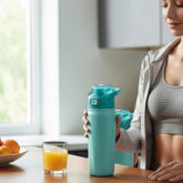 Tiny Tokens teal kids steel water bottle with pop-up straw and lock lid for school and sports.