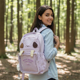 Tiny Tokens lavender purple polyester backpack with 3D puppy face, floppy ears, transparent front pocket, and cloud charm.