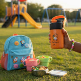Tiny Tokens orange stainless steel fruit infuser water bottle with flip straw lid and carry handle, perfect for school.
