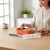 Tiny Tokens orange stainless steel kids lunch box with silicone seal, transparent lid, cutlery set and bonus pen.