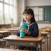Tiny Tokens teal 1.2L insulated steel tumbler with handle and straw for kids. Double-wall, scratch-resistant matte exterior.