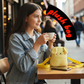 Tiny Tokens yellow plush puppy crossbody bag for kids, made of soft felt with embroidered face and floppy ears.