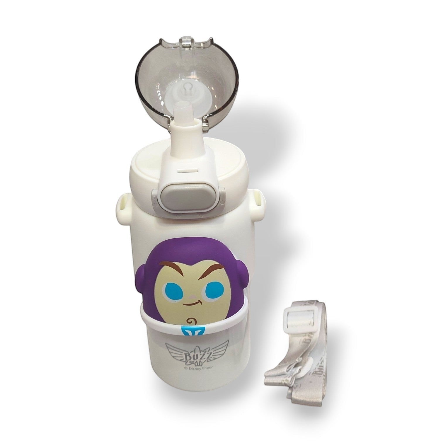 Tiny Tokens Buzz Lightyear kids water bottle with 3D silicone badge, flip straw lid, and adjustable strap. White plastic.