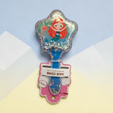 Tiny Tokens blue mermaid glitter hair comb with star-shaped head and soft bristles for scalp massage.