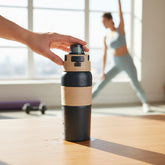 Tiny Tokens navy and beige stainless steel sports water bottle with push-button flip lid and built-in straw.