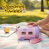 Tiny Tokens pink submarine steel water bottle with straw lid, snow globe, and adjustable shoulder strap for kids.
