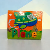 Tiny Tokens wooden plane puzzle board with chunky 3D letters for early literacy learning.
