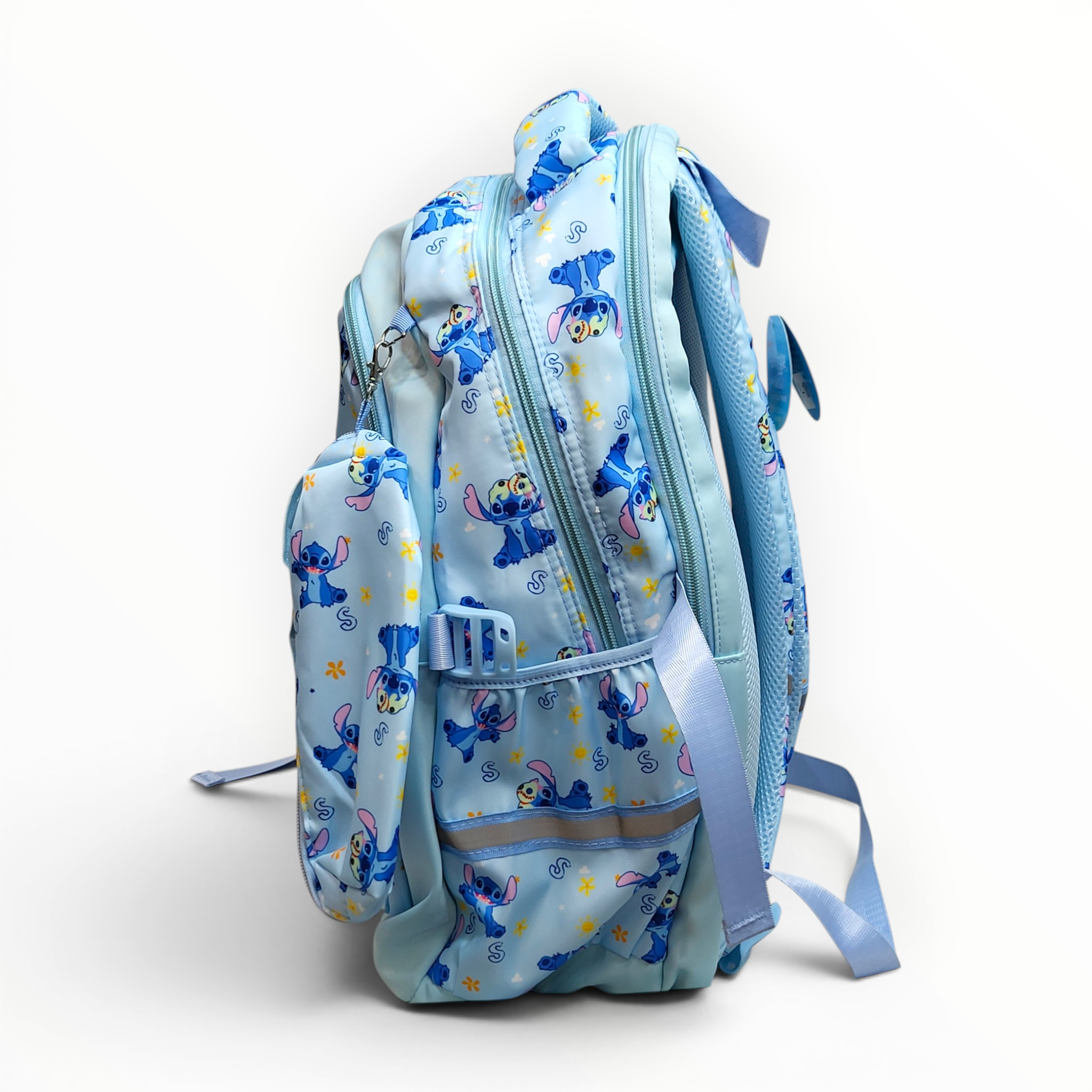 Side view of the Stitch backpack highlighting the multiple zipper compartments, side bottle pocket with reflective tape, and clipped accessory case.