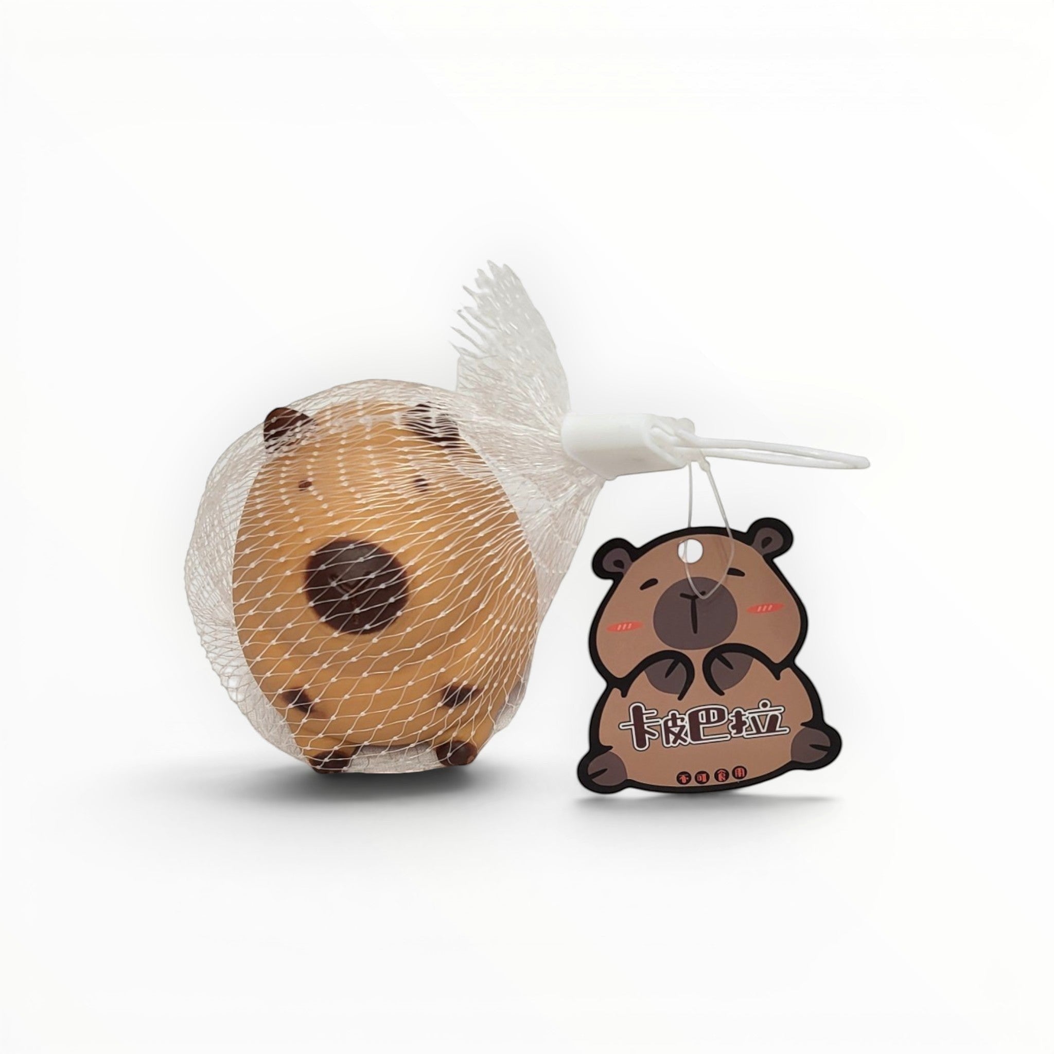 Tiny Tokens brown capybara squeeze toy in mesh bag with cute tag. Soft rubber sensory toy for kids.