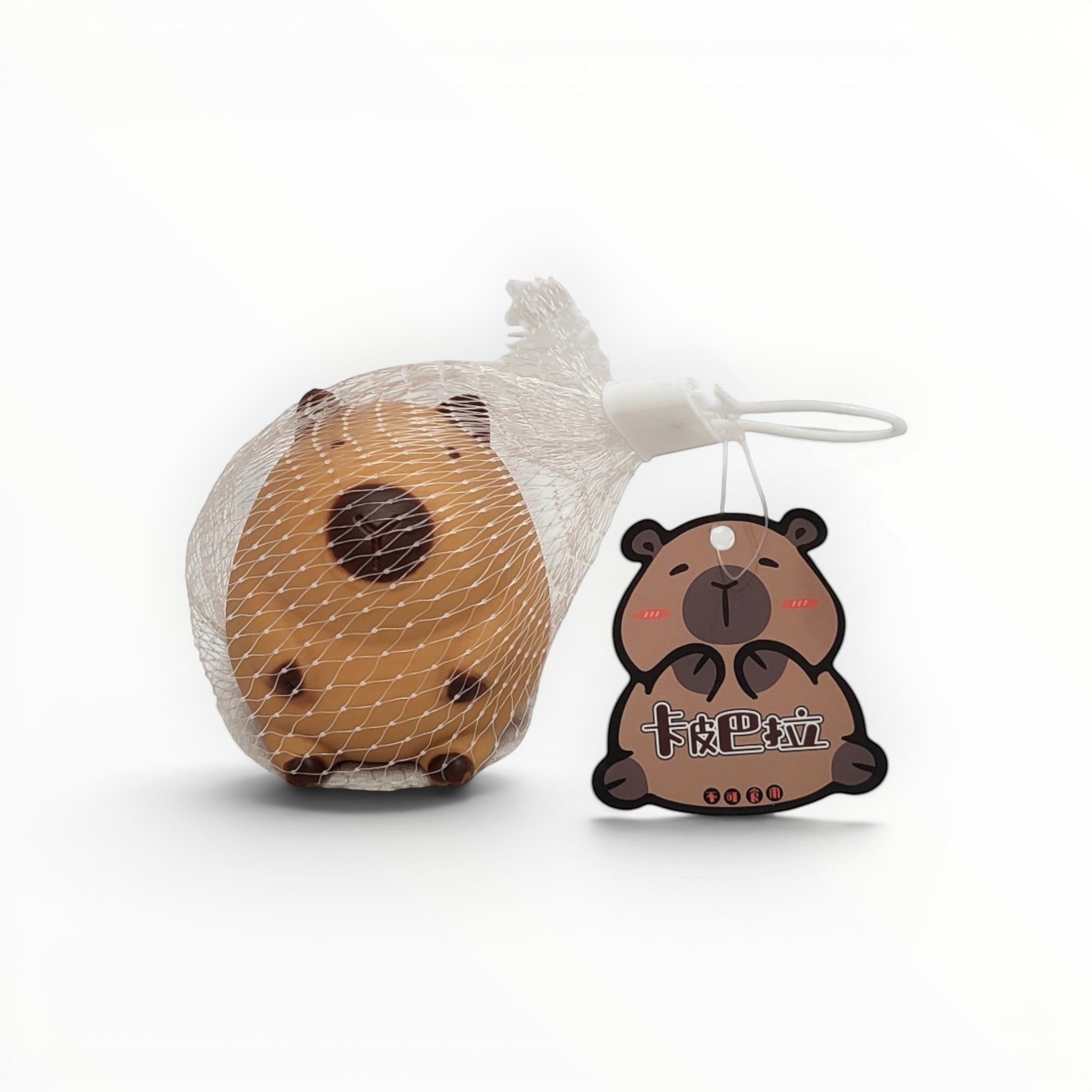 Tiny Tokens brown squishy capybara stress relief toy in mesh bag with cute tag. Soft rubber animal for kids.