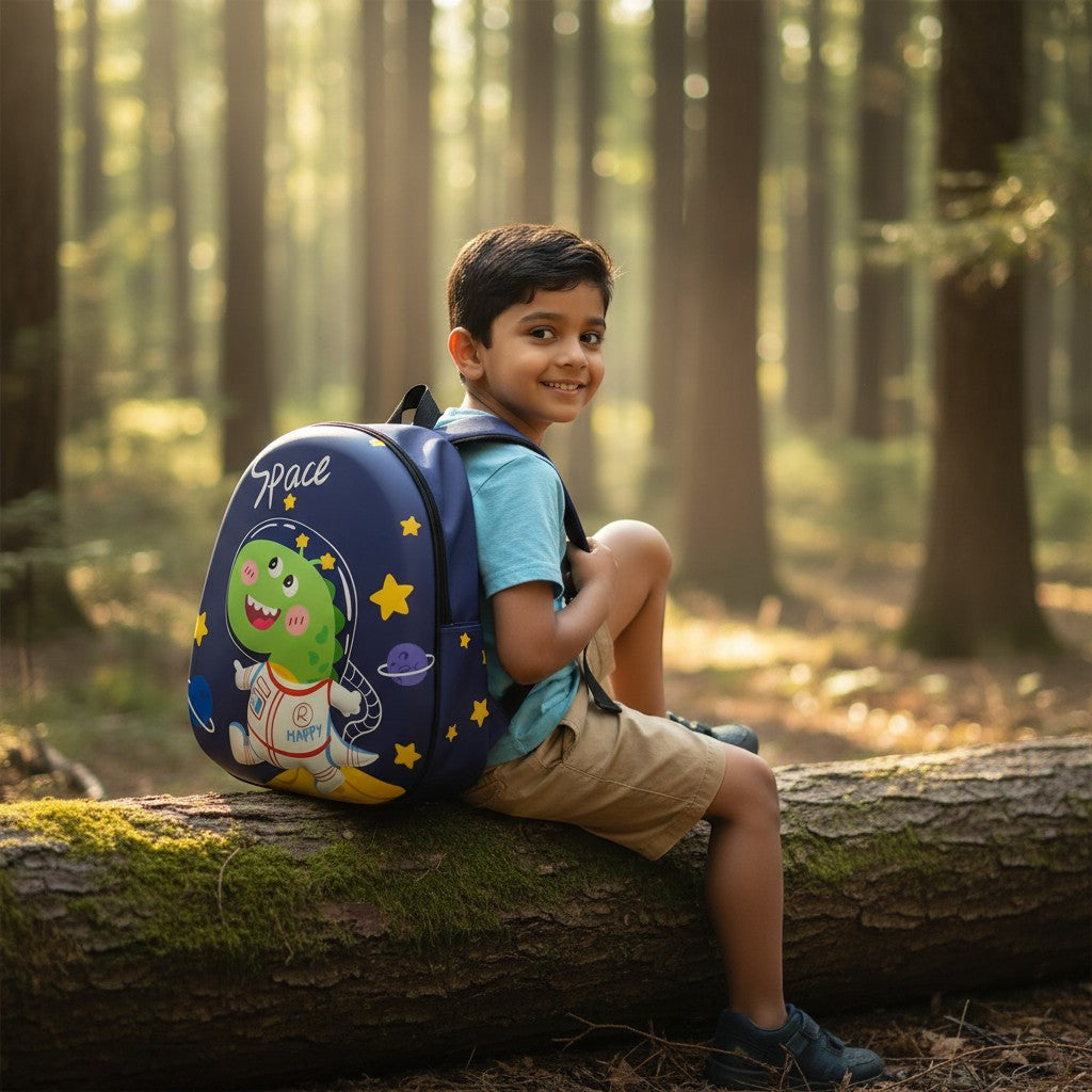 Tiny Tokens blue hard shell backpack with a green astronaut dinosaur and stars. Features 'Space' text and planets.