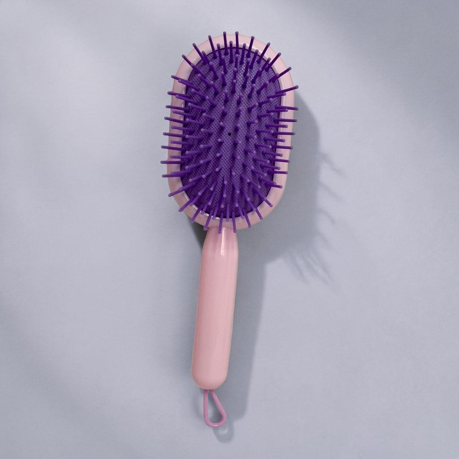 Tiny Tokens pink and purple oval cushion hair brush with soft flexible bristles for kids.
