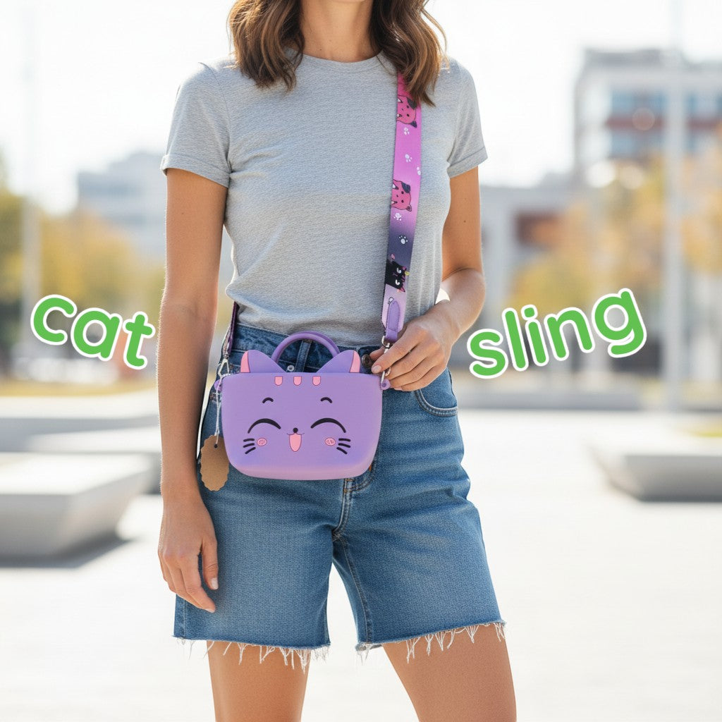 Tiny Tokens purple silicone cat handbag for kids with a cute 3D face and a colourful cat-print strap.
