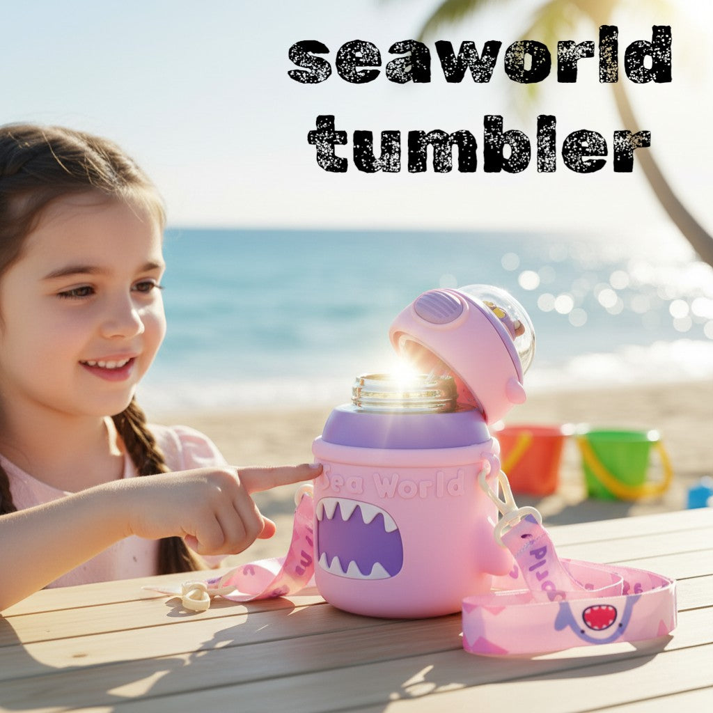 Tiny Tokens pink and purple shark insulated steel water bottle with straw lid and shoulder strap for kids.