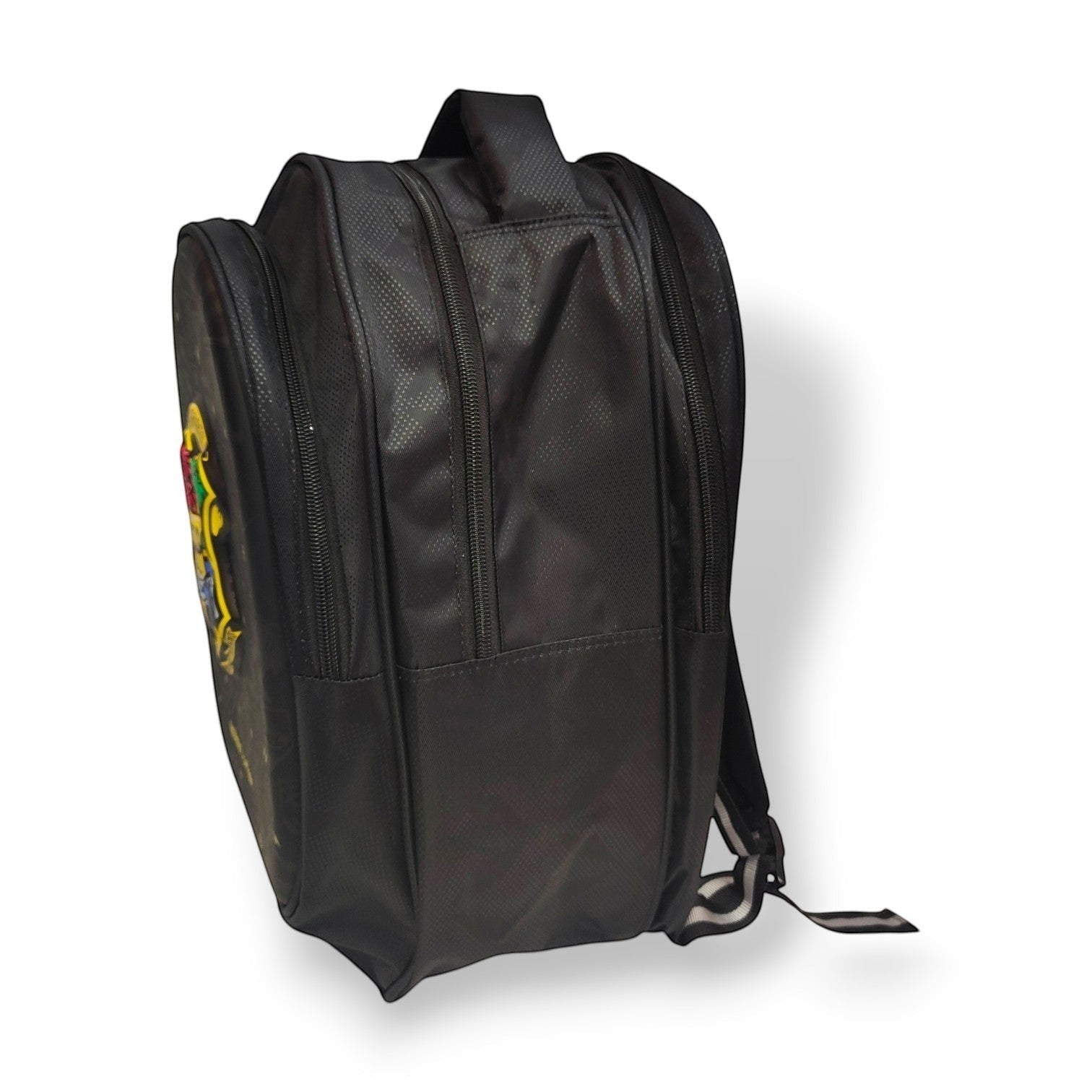 Tiny Tokens Harry Potter Hogwarts backpack in black with embroidered crest and gold lightning bolts. Features multiple zippered compartments and padded straps.