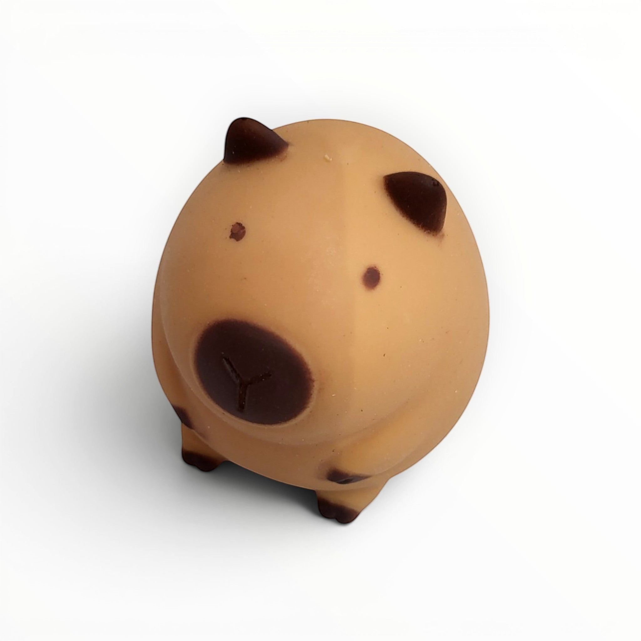 Tiny Tokens brown squishy capybara stress relief toy for kids, made of soft rubber with dark brown markings.