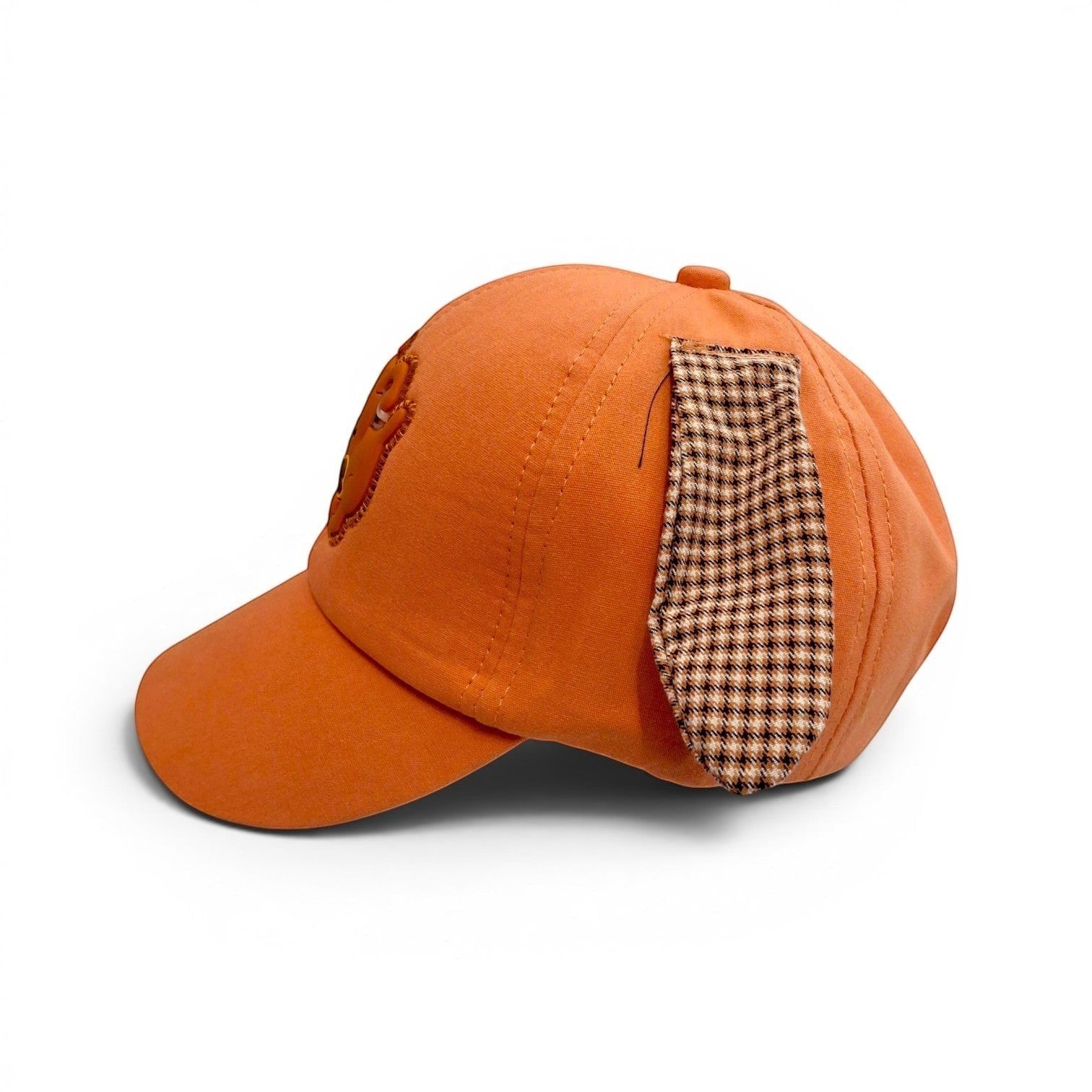 Tiny Tokens orange cotton baseball cap for kids with 3D floppy houndstooth ears and a rubber dog badge.