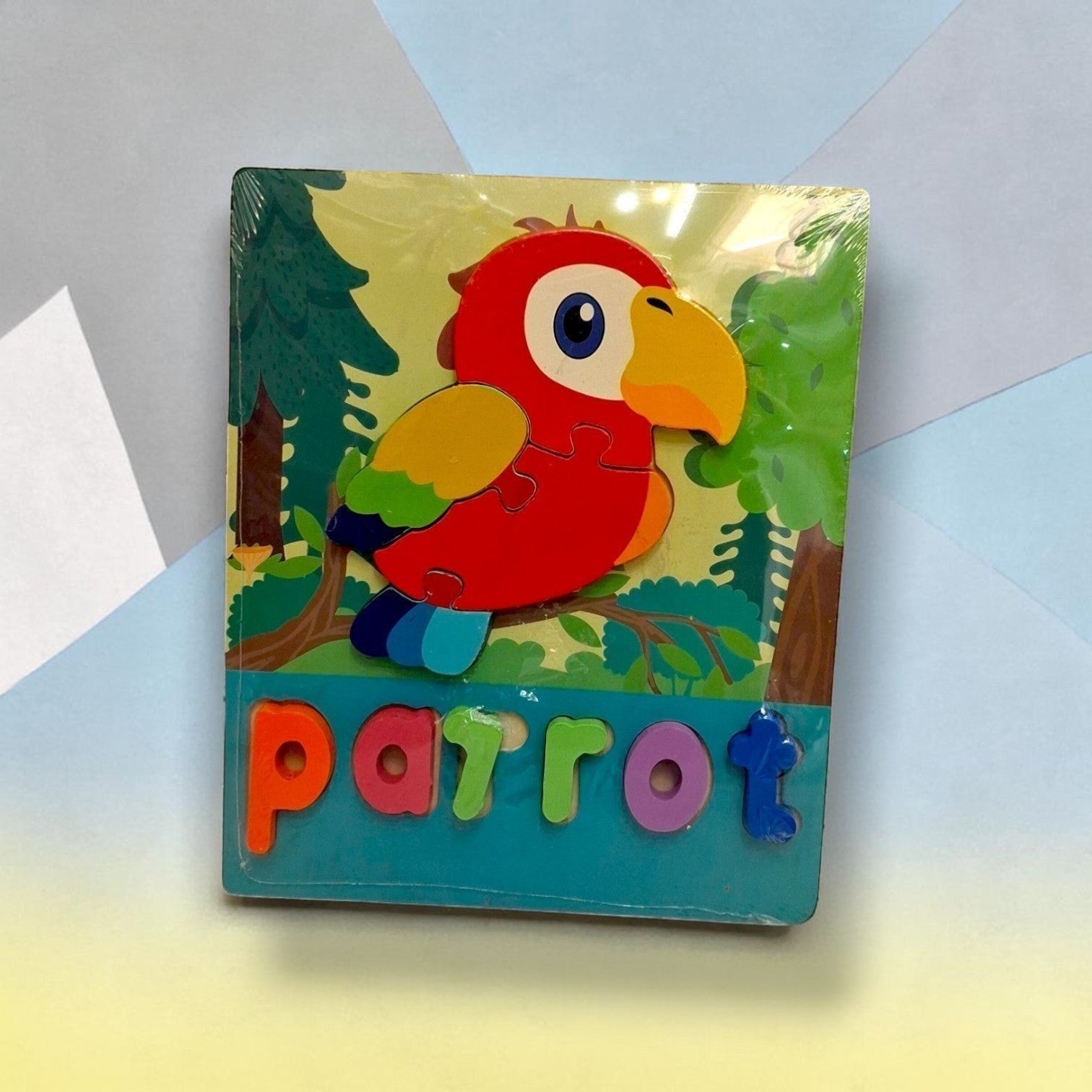 Tiny Tokens parrot wooden word puzzle board with chunky 3D letter pieces for early literacy learning.