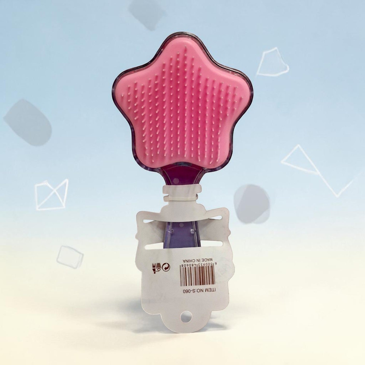 Tiny Tokens pink star-shaped hair comb with soft bristles and a transparent handle filled with glitter. Ideal for kids.
