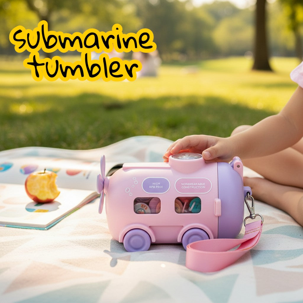 Tiny Tokens pink submarine steel water bottle with straw lid, snow globe, and adjustable shoulder strap for kids.
