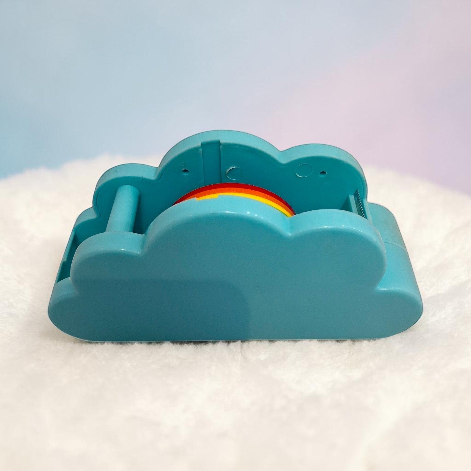 Tiny Tokens teal cloud-shaped tape dispenser with rainbow tape roll, made of durable ABS plastic.