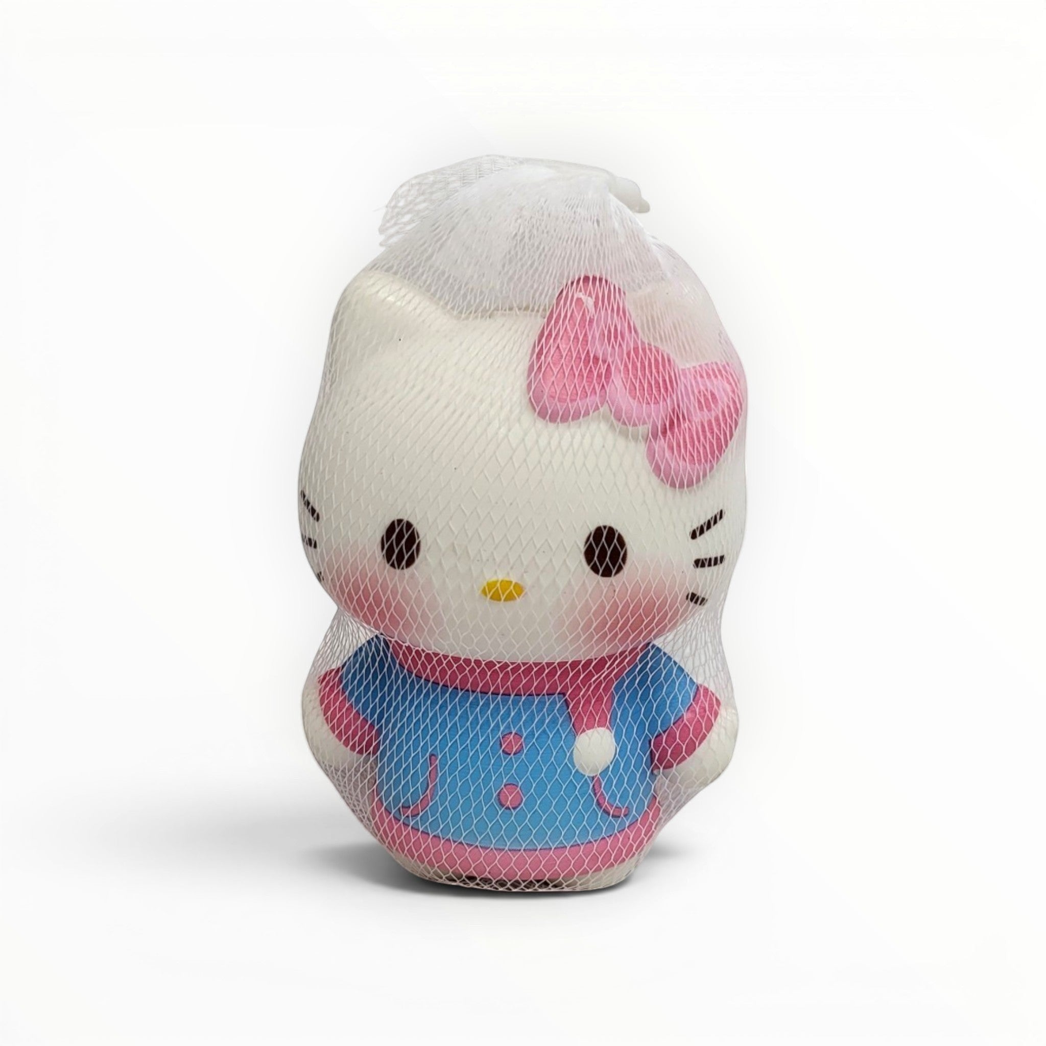 Tiny Tokens white cat squishy toy with pink bow and blue outfit, made of soft rubber for stress relief and sensory play.