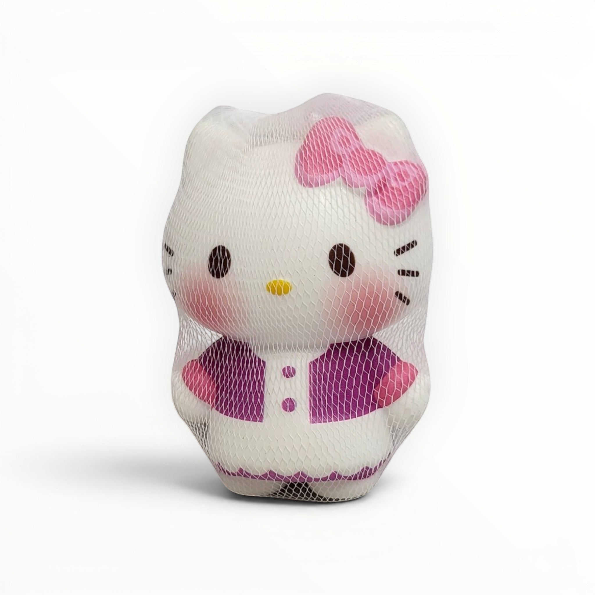 Tiny Tokens white cat squishy toy with pink bow and purple outfit, made of soft rubber for stress relief and sensory play.