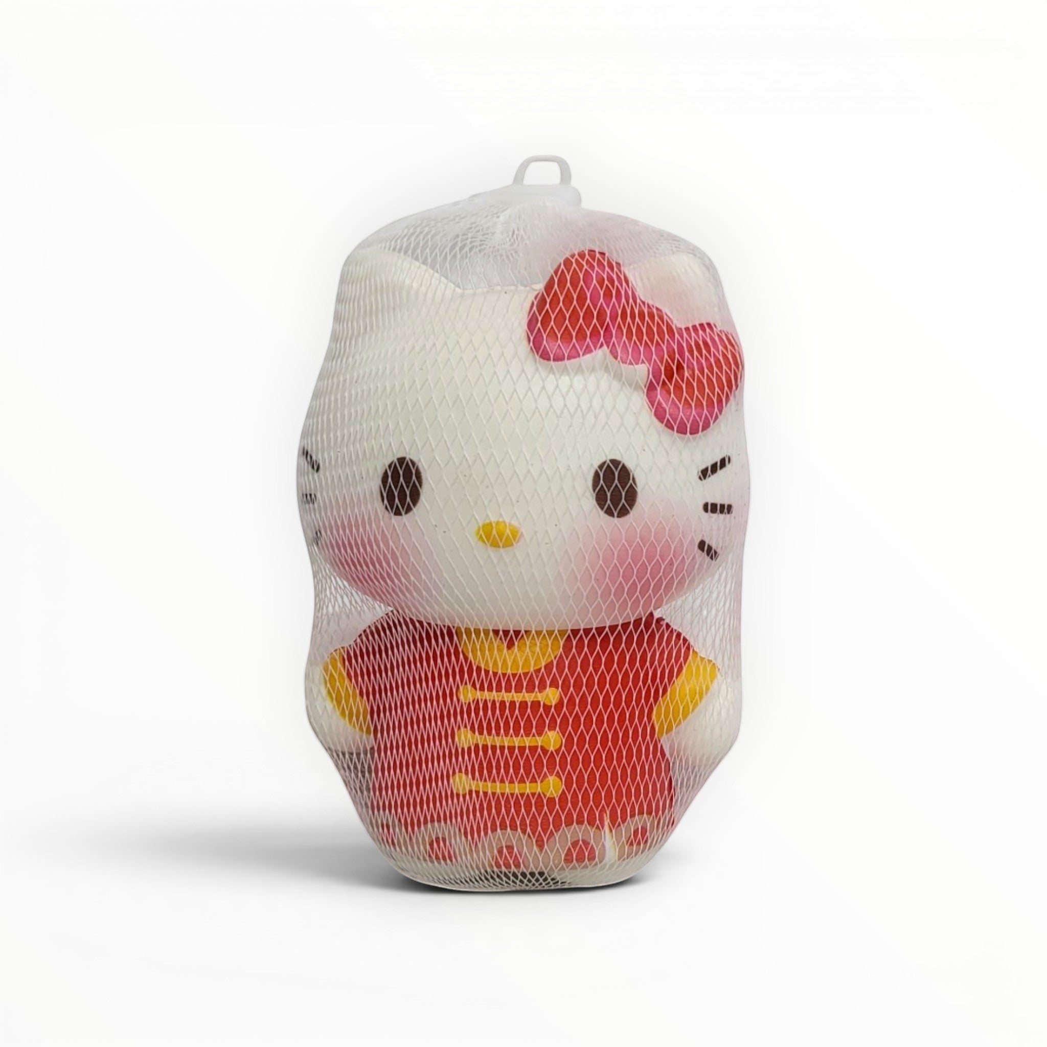Tiny Tokens white cat squishy toy with pink bow and red outfit, made of soft rubber for stress relief and sensory play.