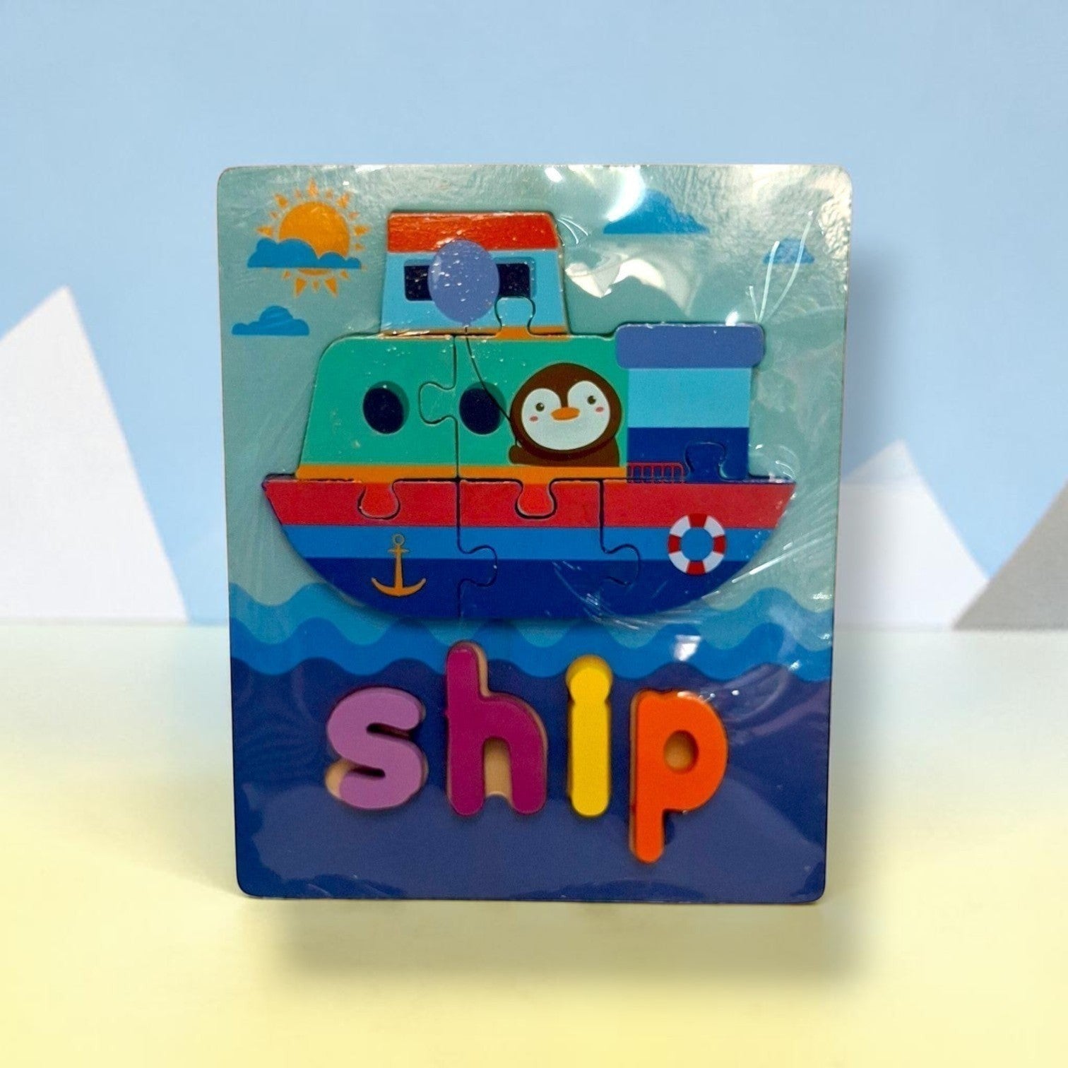 Tiny Tokens wooden ship puzzle board with chunky 3D letter pieces for early literacy learning.
