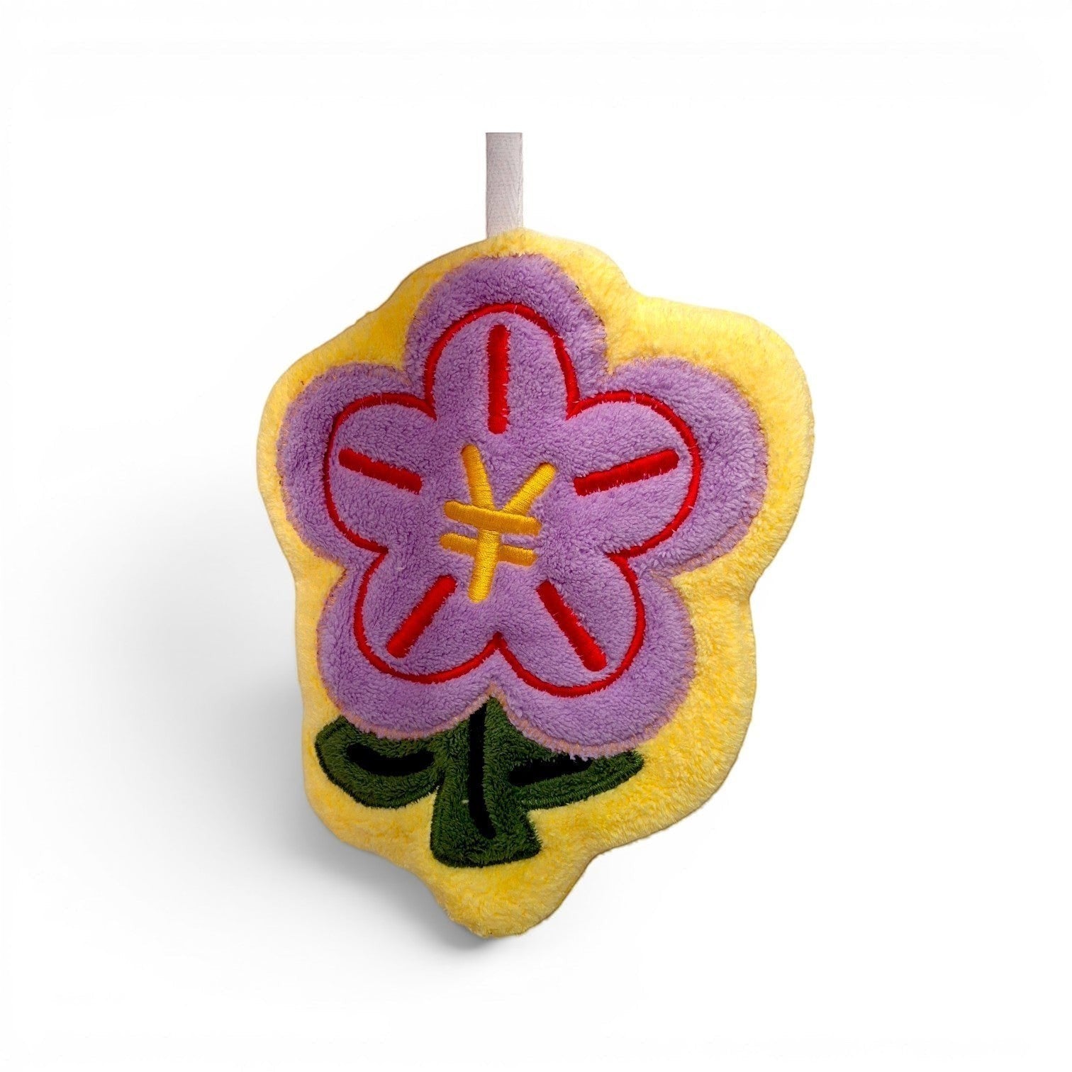 Tiny Tokens yellow plush hand towel with purple flower design and hanging loop.